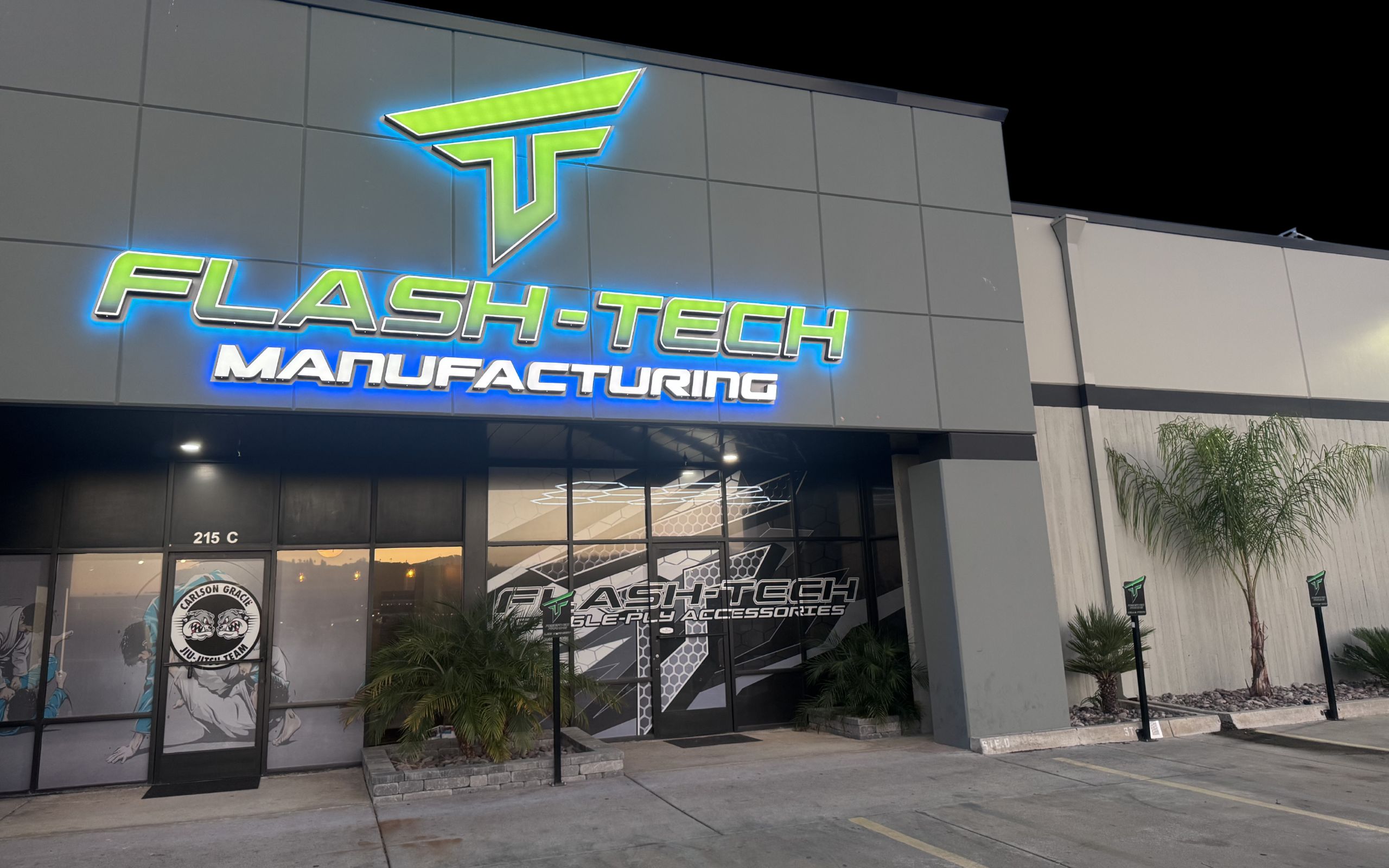 Flash-Tech Manufacturing building exterior with illuminated Flash-Tech sign and entrance to single-ply roofing accessory manufacturer in San Diego.